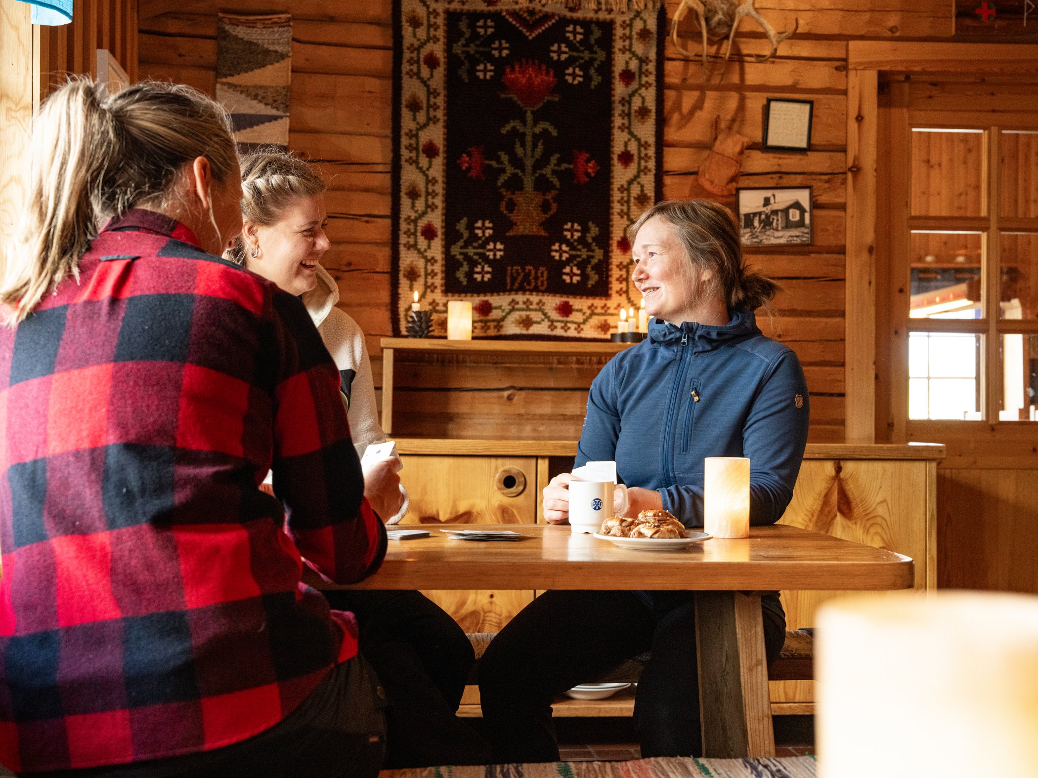 Guests enjoying fika in a mountain station.