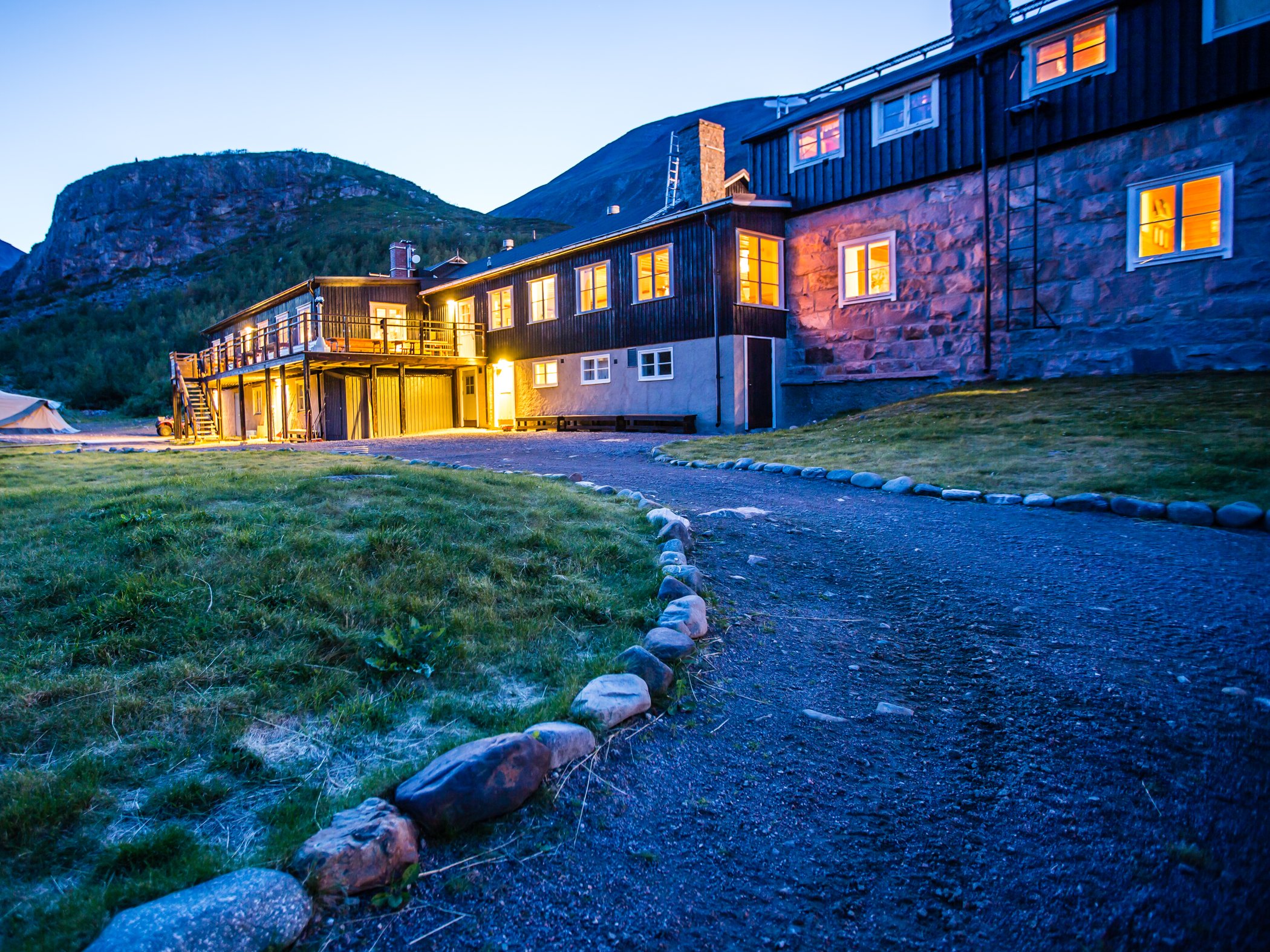 Mountain station illuminated at dusk.