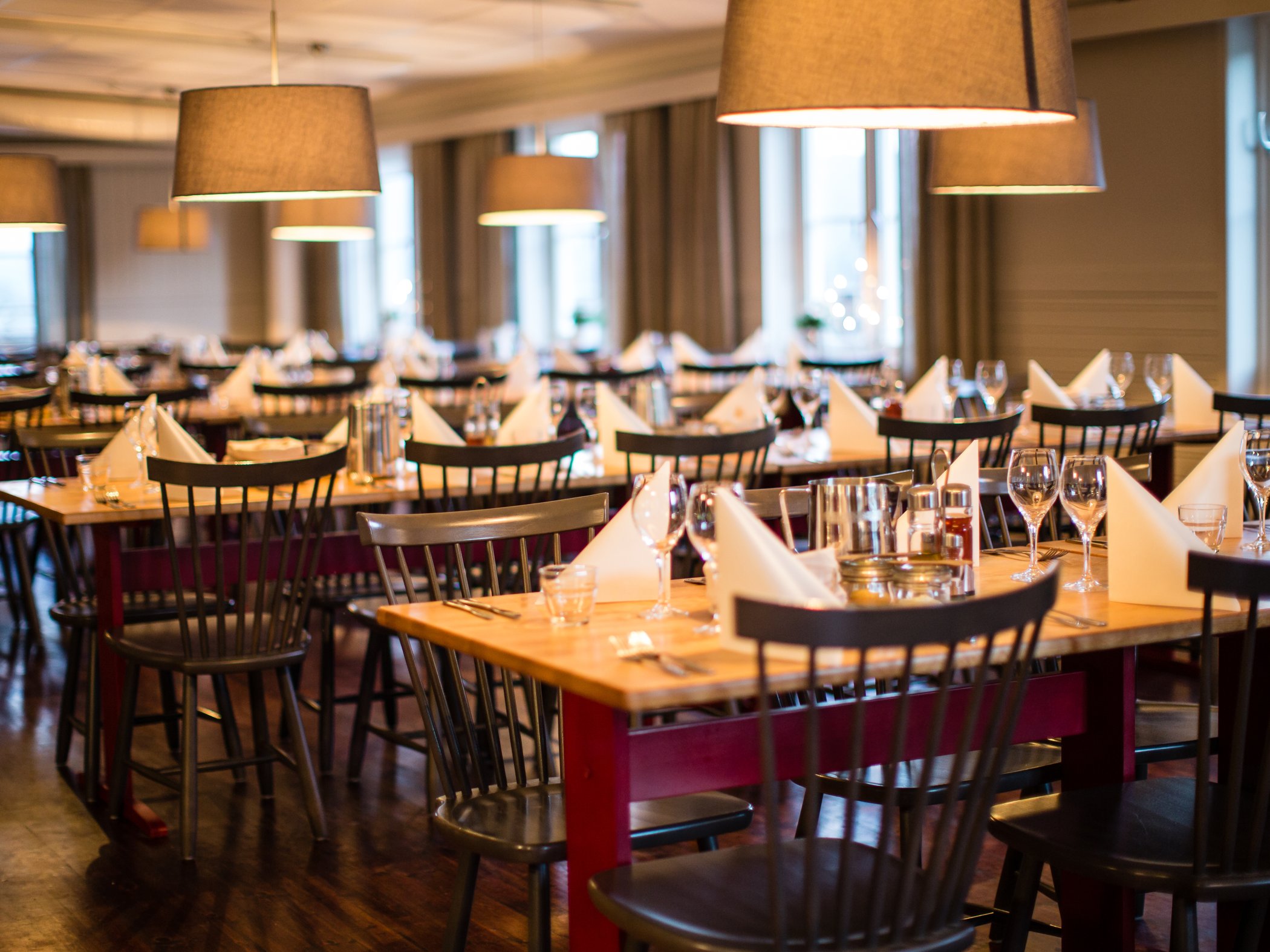 Dining room with set tables at a mountain station restaurant.