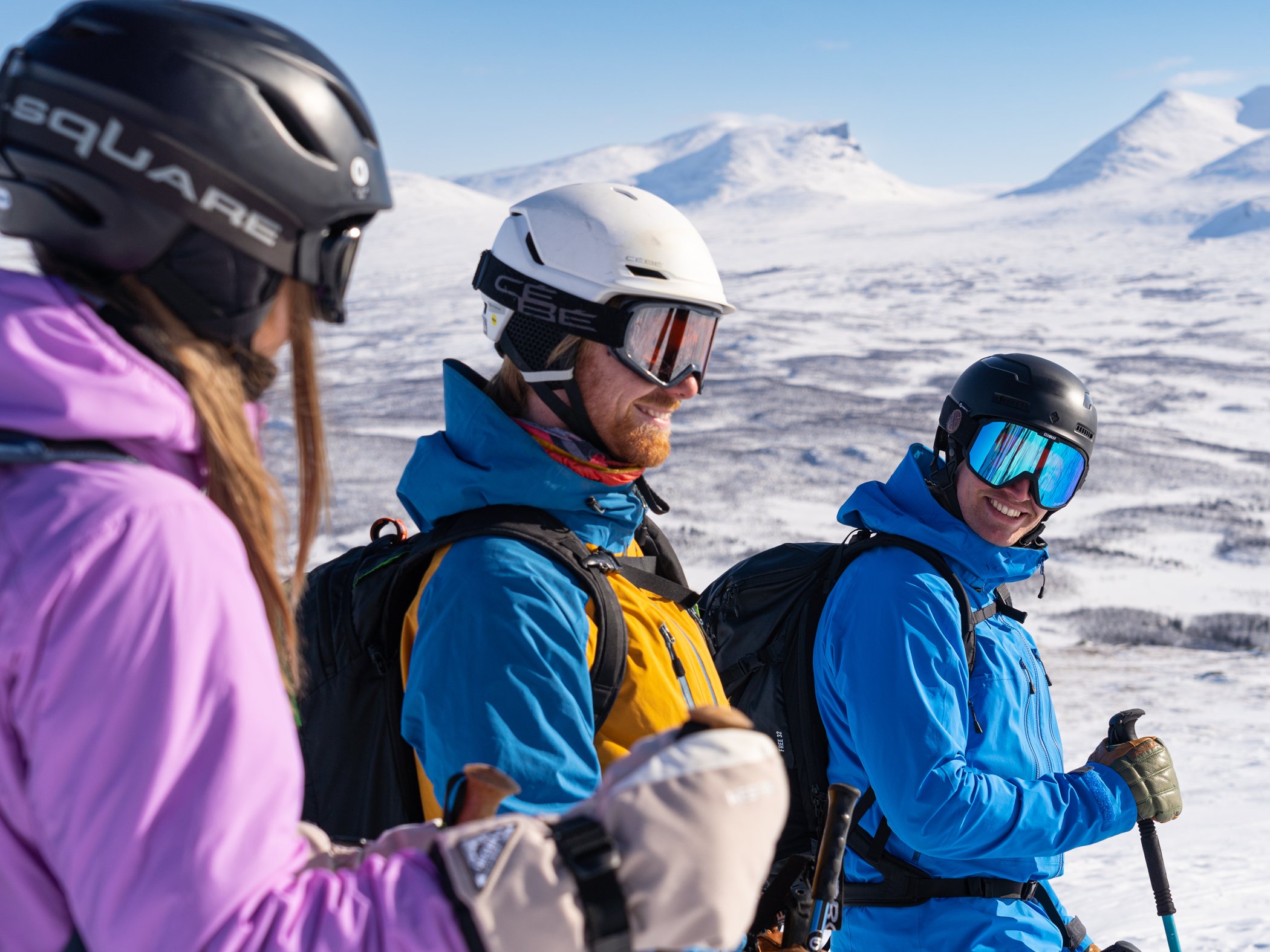 Participants on a ski touring excursion take a break with views of the mountains in Abisko.